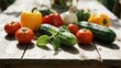 © Iris - Fresh vegetables including tomatoes, cucumbers, bell peppers, and herbs arranged on a wooden table outdoors.