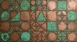 © Muhammad Wasil - Geometric copper tiles show varied shapes  verdigris arranged in a pattern