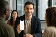 © Who is Danny - Businessman showing smartphone mockup to diverse team in office meeting with bright background, technology presentation concept focus. Ai generative