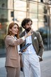© Zoran Jesic - Businesspeople discussing a project using tablet in urban setting