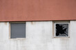 © João Macedo - Broken window showing neglect in run down building facade
