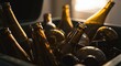 © Photyn Studio - A collection of empty brown glass bottles and jars are gathered in a bin for recycling.Concept of glass waste sorting and recycling.