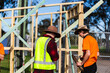 © Austockphoto - young aussie tradie apprentices working on building frame small project