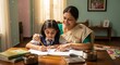 © Thumbs - Indian grandmother assists grandchild with homework in a warm, loving setting at home during the afternoon