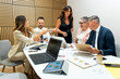 © Alfonso Soler - Business people meeting in modern office discussing strategy