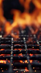 Wall Mural - Close-up shot of a grill with intense flames burning in the background, perfect for use in cooking or BBQ themed projects