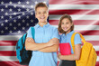 © New Africa - Students with backpacks against flag of USA. Language school