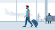 © creativestock - Man walking with suitcase in modern airport terminal