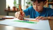© Viktor - Young boy draws Indian flag with orange, green crayons on white paper. Child concentrates on art project, focusing on colors, shapes for national symbol. Home activity inspires patriotic feeling.