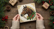 © SvGreen - Woman holding vintage postcard with horse illustration during Christmas