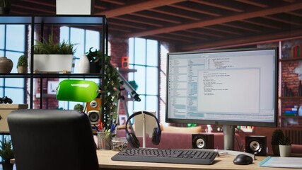 UI on PC screen in home office with programming code being executed. Coding application UI used by IT programmers to write and test code in modern apartment, panning shot