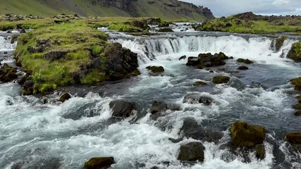 Canvas Print - creek with flowing waterfall cascade in southern iceland.