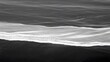 © Abdul - Monochrome ocean wave pattern from above, black and white sea water
