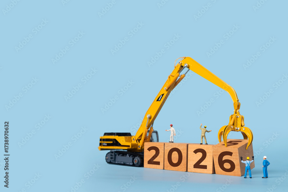 Transitioning from 2025 to 2026 with wooden blocks and miniature ...