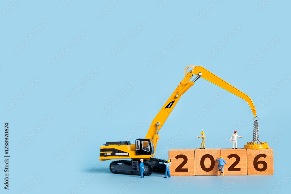 Transitioning from 2025 to 2026 with wooden blocks and miniature ...