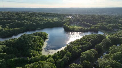 Wall Mural - Lake Surrounded With Lush Green Vegetation In New Haven, Connecticut - Drone Shot