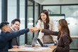 © aekachai - Successful Business Team Putting Hands Together in Unity