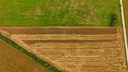 Wall Mural - Aerial timelapse of harvester in farmland representing climate and food industry
