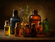© Uzma Shafique - Apothecary bottles with herbs isolated on transparent background