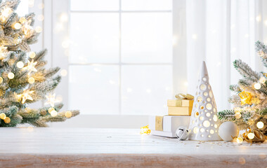 Wall Mural - Gift boxes and Christmas tree decoration background with copy space on wooden table