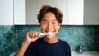 © Z A C - Boy brushing teeth in bathroom.