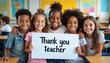 © miss irine - Group of smiling diverse kids holding a Thank you teacher sign. Happy children embrace each other. Pupils show gratitude at school. Positive education, learning, and teamwork.