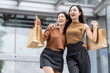 © crizzystudio - Happy asian friends enjoying shopping day with bags