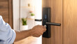 © Adobe worker  - Person unlocking smart door with fingerprint scanner hand smart lock