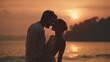 © maxximmm - The man and woman stand closely by the sea as the sea glows under the sunset. Silhouetted by the sunset, the man and woman share a moment by the tranquil sea.