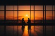© At My Hat - Silhouettes of two people against a sunset from an airport window. Ideal for travel blogs or articles about connecting with someone new.