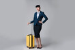 © New Africa - Positive stewardess with suitcase on light grey background
