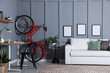 © New Africa - Red bicycle and stylish furniture near grey wall indoors