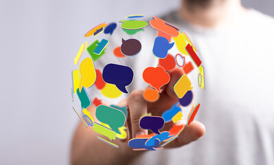 Conceptual global communication network with colorful speech bubbles for connecting people and sharing information. Social media technology conc