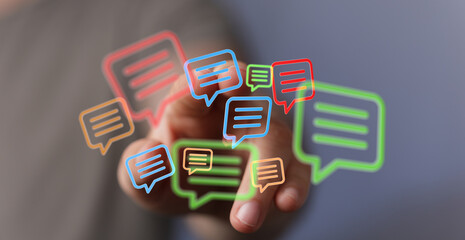 Person touching illustration of digital speech bubbles in various colors showcasing communication and technology on a blurred background.