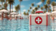 © KETE - A bright red first aid kit stands out against the tranquil blue water of a pool, symbolizing safety, care, and readiness to address emergencies during summer fun.