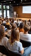 © pvl0707 - Engaging audience at a modern conference venue during a professional presentation on a sunny afternoon