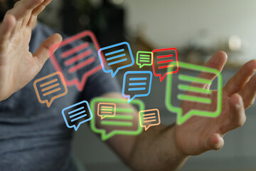 Wall Mural - Digital communication concept. Human hands interacting with colorful glowing digital speech bubbles. Symbolic of connection and conversations.