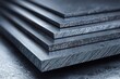 © BYAI - Close-up view of stacked metal sheets showing texture and detail in a well-lit industrial setting