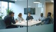 © Hyejin Kang - Multicultural international employees talking at team office meeting sit in conference table behind glass door.
