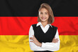 © New Africa - Happy student against flag of Germany. Language school