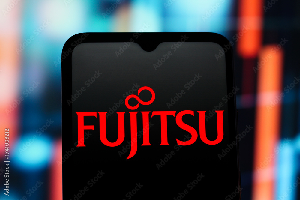 In this photo illustration, the Fujitsu logo is seen displayed on a ...