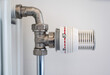 © Werner - Classic central heating thermostat knob and pipe in Jette, Brussels Capital Region, Belgium