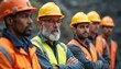 © Maryna - Team of diverse workers wearing safety gear. Mining engineers in helmets, vests listening to supervisor. Construction staff at work site. Men work together in safety training instruction. Industry