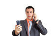 © Tijana - Businessman Talking on Cellphone and Landline