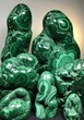 © Sutelo - Polished malachite specimens showcasing bands and swirling patterns