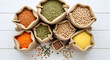 © Deny - Assortment of Burlap Sacks Filled with Various Legumes and Grains on White Wooden Surface