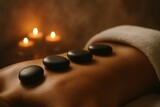 Aromatherapy spa scene with hot basalt stones on back in serene candlelit wellness mood