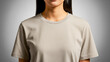 © Bayu - Realistic mockup of an Asian woman wearing plain beige cotton T-shirt, showing clean fabric texture and neutral lighting for fashion presentation.