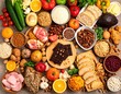 © AndiAzis - A vibrant and diverse assortment of fresh fruits, vegetables, nuts, and grains on a table display.