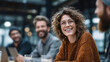 © benjamin - A candid portrait of a woman smiling radiantly during a collaborative discussion at a cafe. Capture the positive vibes and camaraderie of the scene.